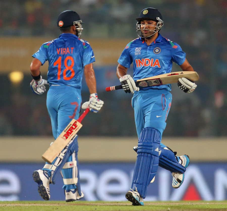 Virat Kohli and Rohit Sharma joggs a run during their 100 runs partnership